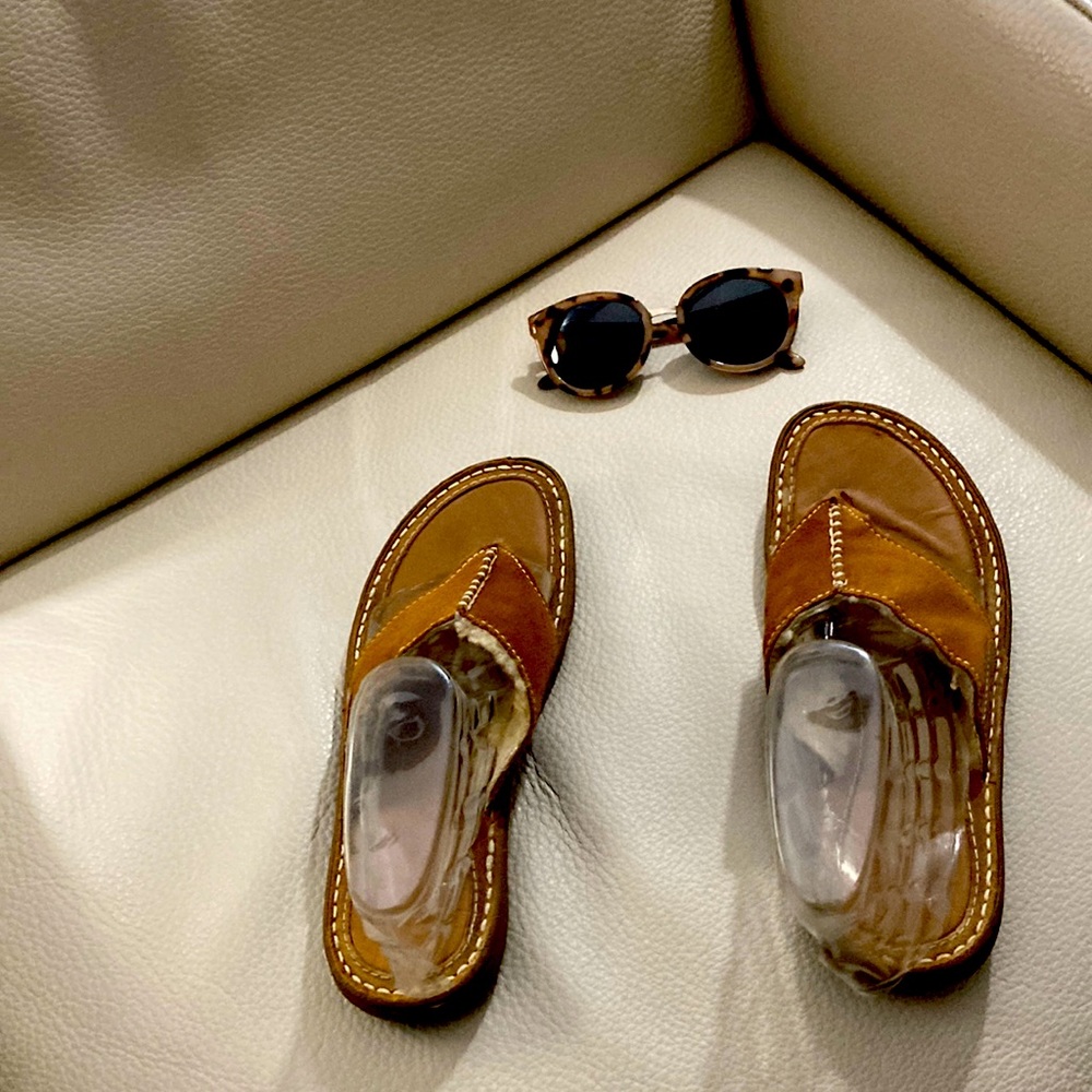 Ugg sandals with some wear but still have some life in them